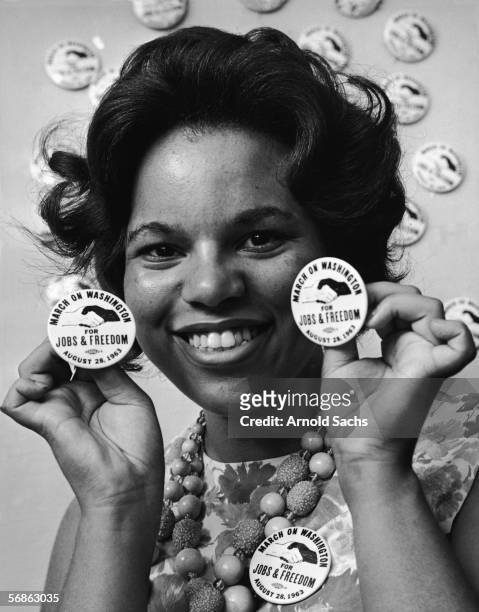 Civil rights campaigner and organizer Karen House holds up buttons for the upcoming 'March on Washington for Jobs & Freedom,' Washington DC, August...