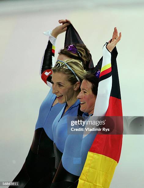 Claudia Pechstein, Anni Fiesinger and Daniela Anschuetz Thoms of Germany celebrate winning the Gold Medal against Canada in women's speed skating...