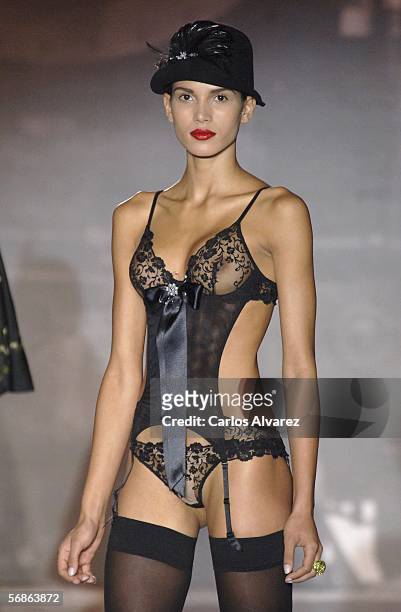 Brazilian model Raica Oliveira, girlfriend of Real Madrid's soccer player Ronaldo, walks down the runway at the Andres Sarda fashion show as part of...