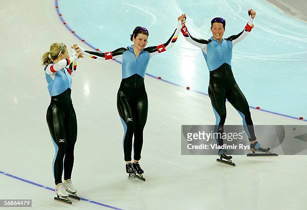Daniela Thoms Anschuetz, Anni Friesinger and Claudia Pechstein of Germany celebrate defeating Canada with a time of 3:01.25 to win the gold medal in...