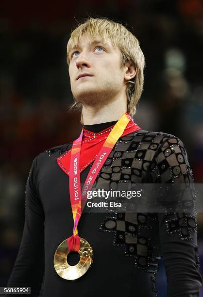 Evgeni Plushenko of Russia stands on the podium after winning the gold medal in Men's Figure Skating following the Men's Free Skate Program Final...