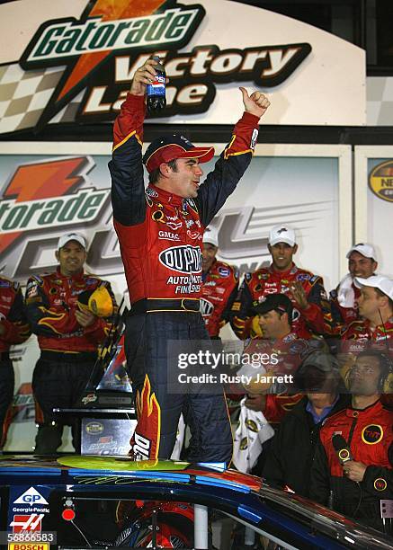 Jeff Gordon, driver of the DuPont Chevrolet, celebrates winning the second NASCAR Nextel Cup Series Gatorade Duel 150 on February 16, 2006 at Daytona...