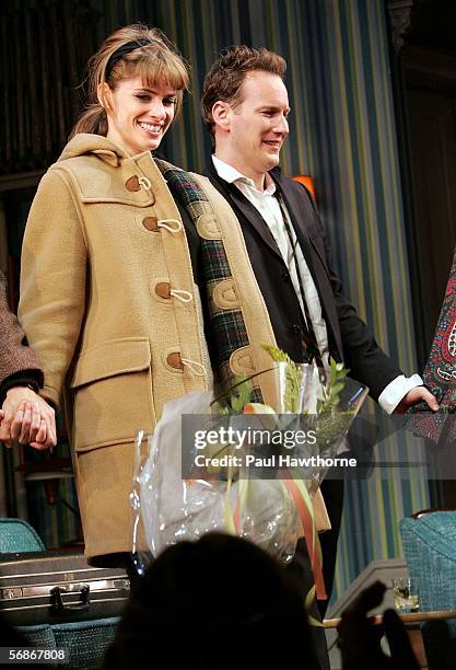 Actors Amanda Peet and Patrick Wilson take the stage during the curtain call on opening night of "Barefoot in the Park" at the Cort Theatre February...