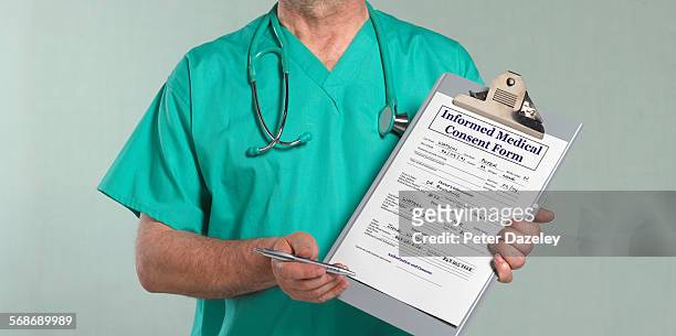 doctor with medical consent form - peter law foto e immagini stock