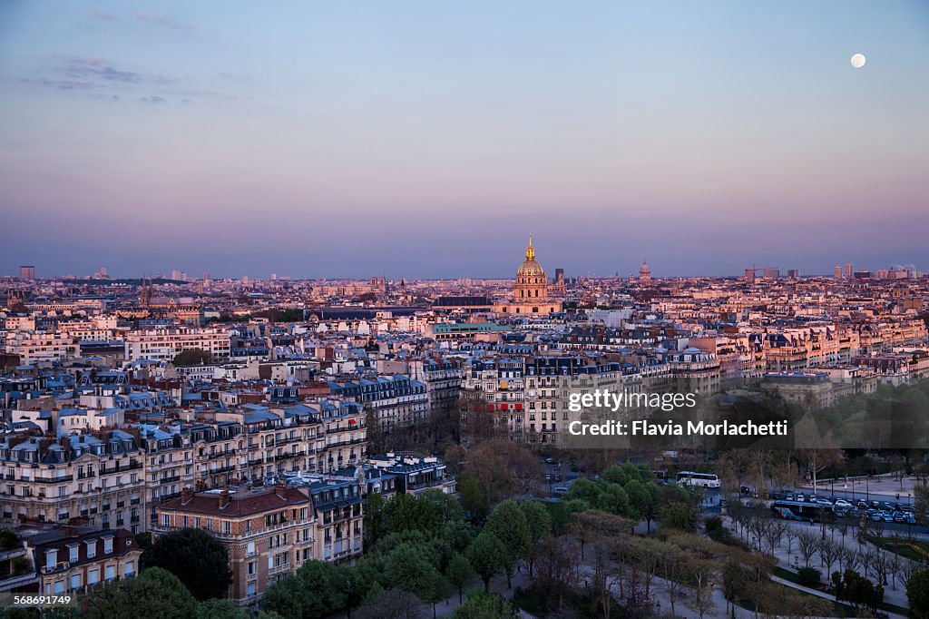 Sunset over Paris with full moon