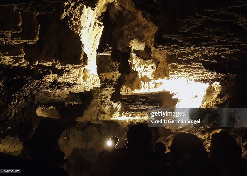 Silhouettes of people in cave Ali Sadr of Iran