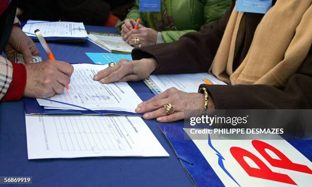 People sign a petition for the referendum against the Catalan statute in Madrid, 17 February 2006. Spain's Popular Party the main opposition party is...