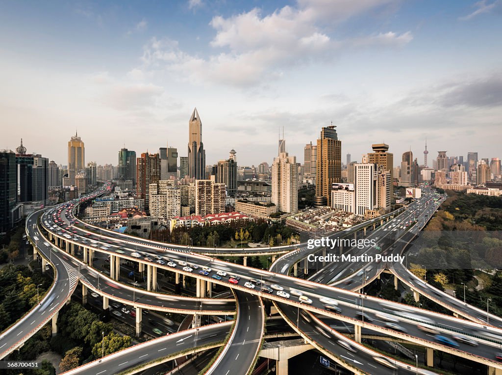 Shanghai skyline and busy road intersection