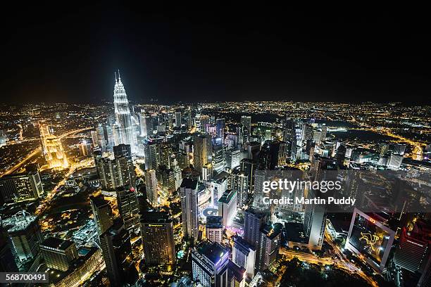 kualu lumpur skyline at night, elevated view - malaysia skyline stock pictures, royalty-free photos & images