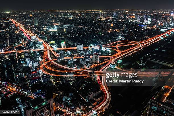 aerial view of road intersection at night - 東南亞 個照片及圖片檔