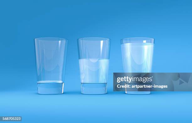 three glasses of water - half stock pictures, royalty-free photos & images