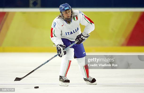 Nadia de Nardin of Italy controls the puck against Germany during the playoff round of the women's ice hockey during Day 7 of the Turin 2006 Winter...