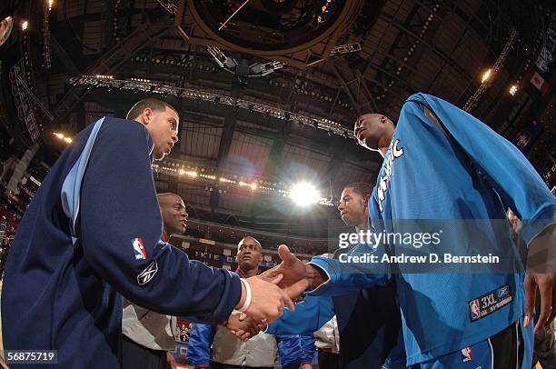 Deron Williams of the Rookie Team greets Dwight Howard of the Sophmore Team at center court during the T-Mobile Rookie Challenge at the 2006 NBA...