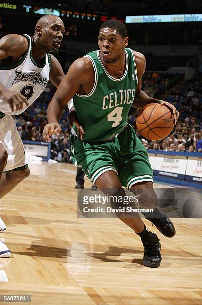 Ryan Gomes of the Boston Celtics drives around Justin Reed of the Minnesota Timberwolves during a game at Target Center on January 30, 2006 in...