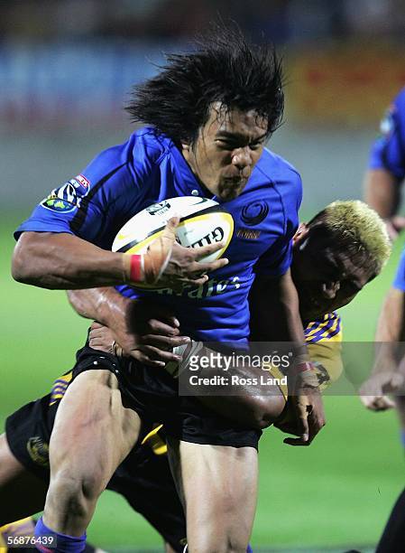 Digby Ioane of the Western Force is tackled by Jerry Collins during the Round 2 Super 14 rugby match between the Hurricanes and the Western Force...