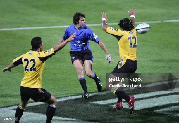 Brock James of the Western Force kicks the ball over the head of Ma'a Nonu during the Round 2 Super 14 rugby match between the Hurricanes and the...