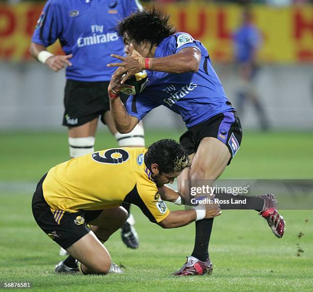 Digby Ioane of the Western Force tackled by Piri Weepu during the Round 2 Super 14 rugby match between the Hurricanes and the Western Force played at...