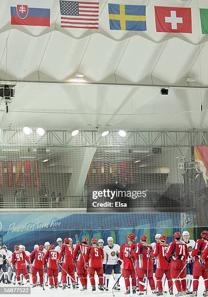 Team Russia and Team Kazakhstan shake hands after the men's ice hockey Preliminary Round Group B match during Day 8 of the Turin 2006 Winter Olympic...