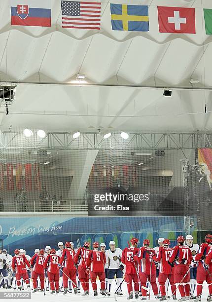 Team Russia and Team Kazakhstan shake hands after the men's ice hockey Preliminary Round Group B match during Day 8 of the Turin 2006 Winter Olympic...