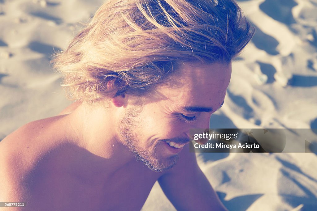 Profile of young man on beach