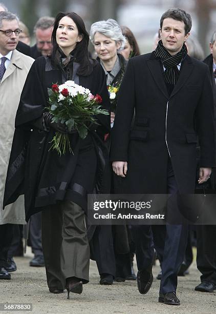 Denmark's Crown Prince Frederik and his wife Crown Princess Mary walk during their visit at the former border 'Waldemarsmauer' between Denmark and...