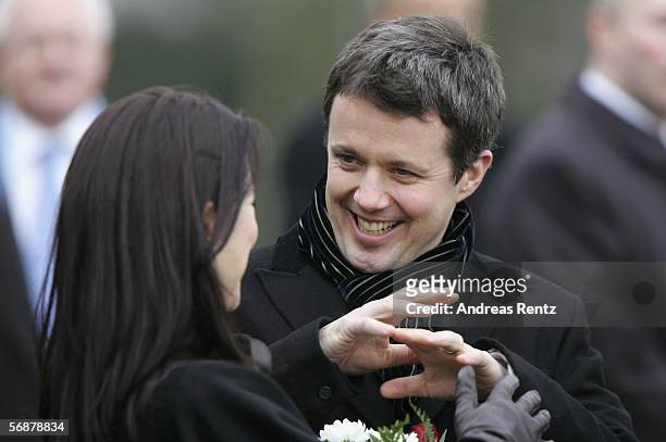 Denmark's Crown Prince Frederik and his wife Crown Princess Mary talk during their visit at the former border 'Waldemarsmauer' between Denmark and...
