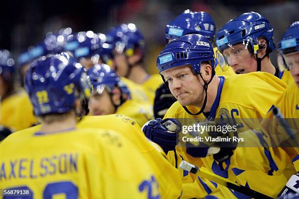 Mats Sundin of Sweden celebrates with his teammate Per Johan Axelsson of Sweden after Axelsson scored the fourth goal during the men's ice hockey...