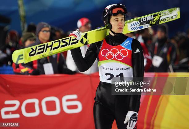 Martin Schmitt of Germany looks on in the Large Hill Individual Ski Jumping Final on Day 8 of the 2006 Turin Winter Olympic Games on February 18,...