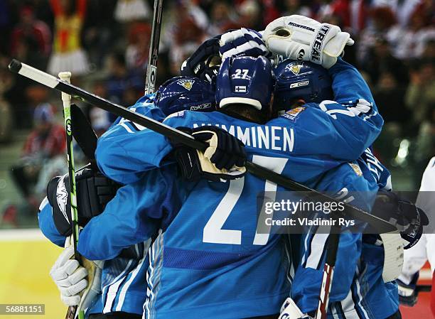 Jere Numminen of Finland celebrates with his teammate Teppo Numminen of Finland after he scored during the men's ice hockey Preliminary Round Group A...