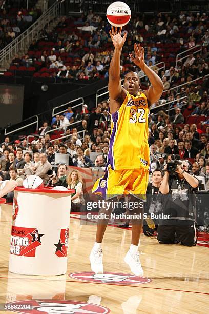 Former Los Angeles Lakers guard Earvin "Magic" Johnson shoots during the Radio Schack Shooting Stars competition on All-Star Saturday Night during...