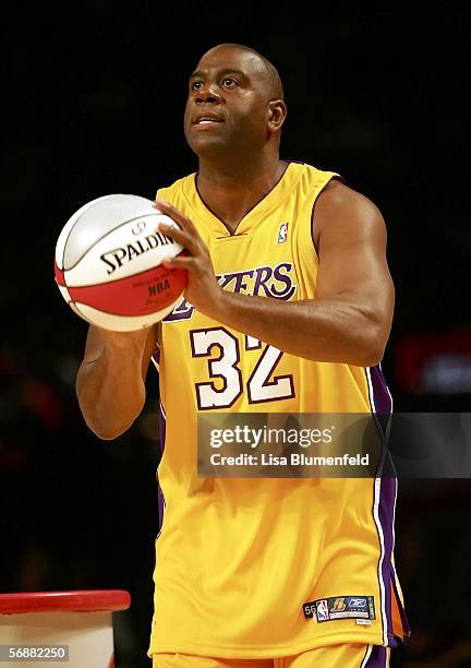 Magic Johnson of the Los Angeles team gets ready to shoot in the Radio Shack Shooting Stars competition during NBA All-Star Weekend at the Toyota...