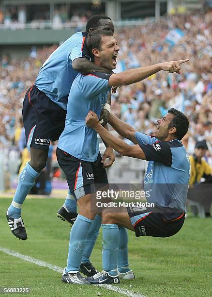 Dwight Yorke, Mark Rudan and Steve Corica of Sydney celebrate Rudans goal during the second leg Major Semi Final between Sydney FC and Adelaide...