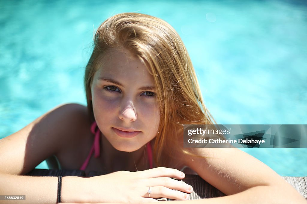 A 14 years old girl in a pool