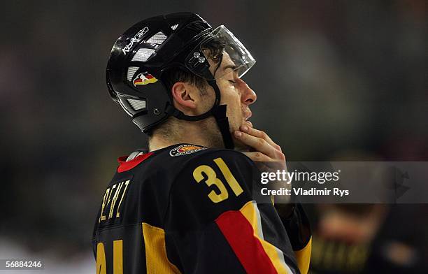 Andreas Renz of Germany rubs his chin after the 2-2 tie in the men's ice hockey Preliminary Round Group A match against Switzerland during Day 9 of...
