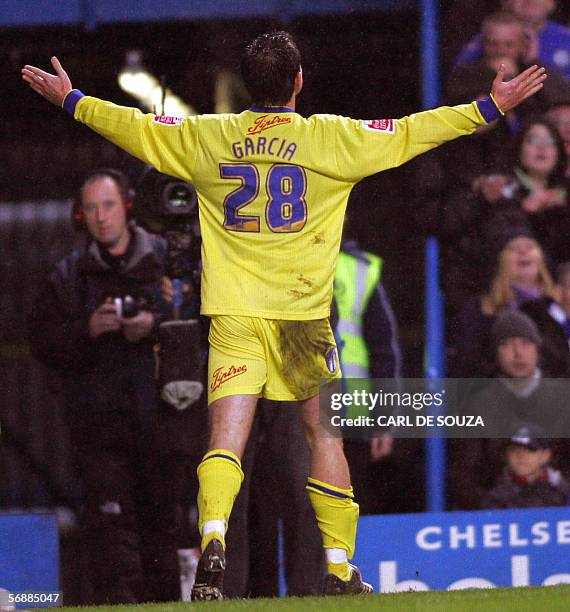 London, UNITED KINGDOM: Colchester's Richard Garcia celebrates after a deflected shot hit Chelsea's Ricardo Carvalho resulting in an own goal during...