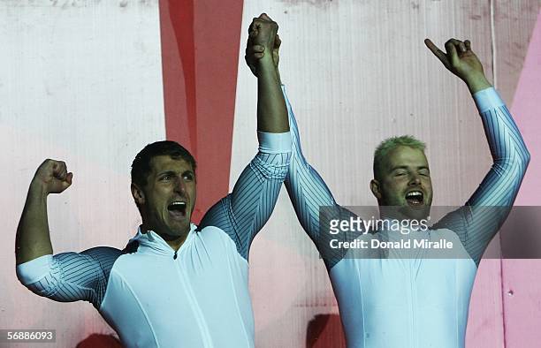 Andre Lange and Kevin Kuske of Germany celebrate after winning the gold medal in the Two Man Bobsleigh Final on Day 9 of the 2006 Turin Winter...