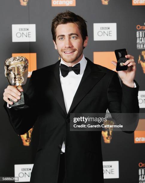 Jake Gyllenhaal poses backstage in the Awards Room with the award for Best Actor in a Supporting Role for 'Brokeback Mountain' at The Orange British...