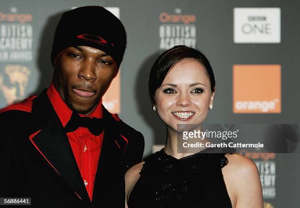 Actors Ashley Walters and Christina Ricci pose backstage in the Awards Room at The Orange British Academy Film Awards at the Odeon Leicester Square...