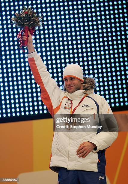 Erben Wennemars of The Netherlands receives the Bronze medal in the men's 1000m speed skating final during the Medals Ceremony on Day 9 of the Turin...