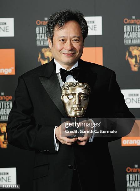 Director Ang Lee poses backstage in the Awards Room with the David Lean award for Achievement in Directing for 'Brokeback Mountain' at The Orange...