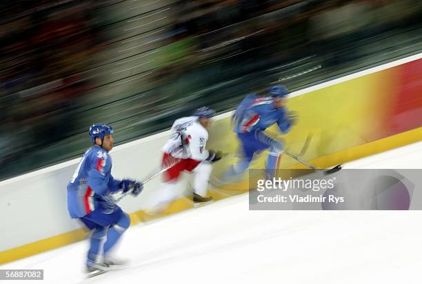 Member of Team Czech Republic skates against members of Team Italy during the men's ice hockey Preliminary Round Group A match during Day 9 of the...