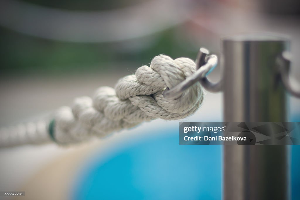 White rope surrounding the swimming pool