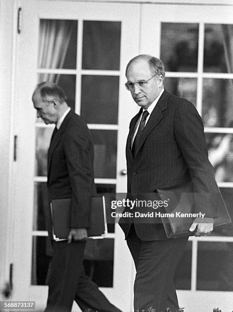 Secretary of Defense Dick Cheney and National Security Advisor Brent Scowcroft in the Rose Garden at the White House to talk about the visit of...