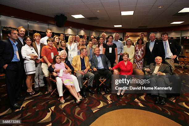 The Bush clan assembles in the Houston Astro's locker room to honor former President George H. W. Bush's 80th birthday on June 12, 2004 in Houston,...