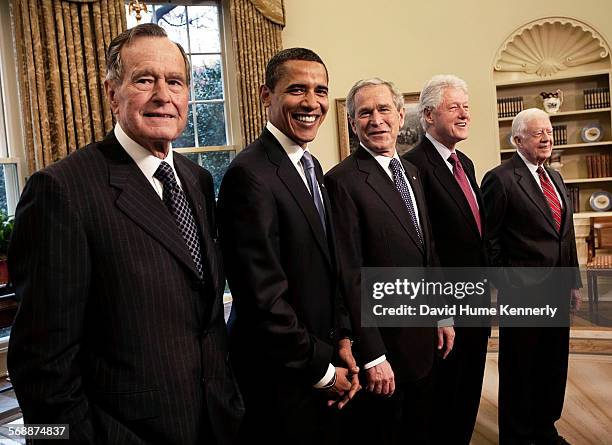 In the oval office, Former President George HW Bush, President-elect Barack Obama, President George W Bush, former Presidents Bill Clinton and Jimmy...