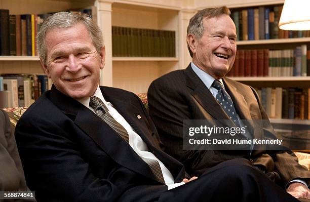 President George W. Bush and his dad former President George H.W. Bush at the Blair House in Washington, D.C., visiting the Ford family after the...