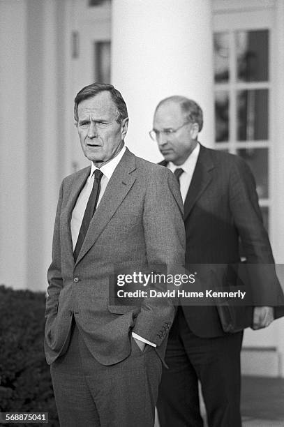 President George H.W. Bush, and Secretary of Defense Dick Cheney in the Rose Garden at the White House talk about the visit of Cheney and Gen. Colin...