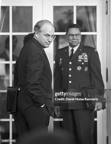 Secretary of Defense Dick Cheney and Chairman of the Joint Chiefs of Staff Colin Powell in the Rose Garden at the White House after talking to...