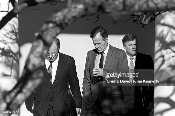 President George H.W. Bush, Secretary of Defense Dick Cheney, and Vice President Dan Quayle in the Rose Garden at the White House talk about the...
