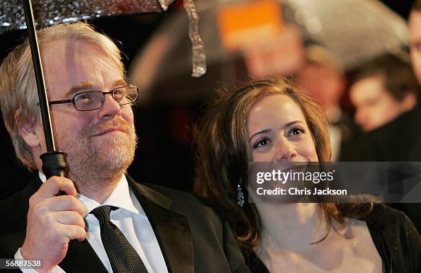 Actor Philip Seymour Hoffman and girlfriend Mimi O'Donnell arrive at The Orange British Academy Film Awards at the Odeon Leicester Square on February...